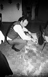1977  Chlausfeier der Schulpflege und Lehrerschaft  im Singsaal Widmer /  Hansueli Braun beseitigt die Hinterlassenschaft  des Samichlausesels